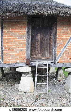 Stock Image - thatch, traditional, country, exteriors. Fotosearch