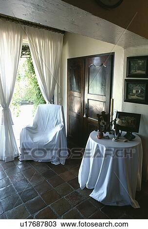 Throw on armchair in living room View Large Photo Image Stock Image - Throw on armchair in living room. Fotosearch