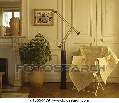Throw on chair in living room View Large Photo Image Stock Photo - Throw on chair in living room. Fotosearch