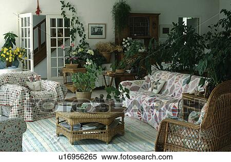 Throw on sofa in traditional living room View Large Photo Image Stock Photography - Throw on sofa in traditional living room. Fotosearch
