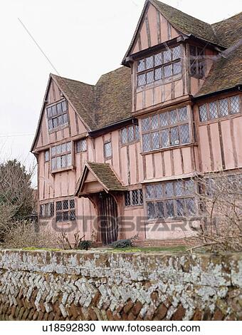 Timbered pink Tudor country house View Large Photo Image Stock Image - Timbered pink Tudor country house. Fotosearch