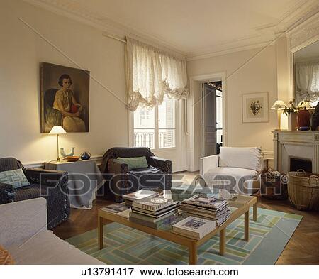 Stock Photo - Traditional apartment living room with loosecover on armchairs. Fotosearch