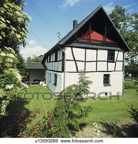 Stock Photo - Traditional black+white country house in Germany. Fotosearch