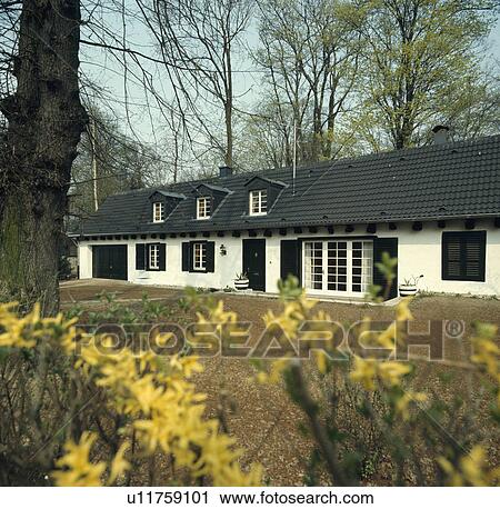 Traditional black+white single-storey country house View Large Photo Image Stock Image - Traditional black+white single-storey country house. Fotosearch