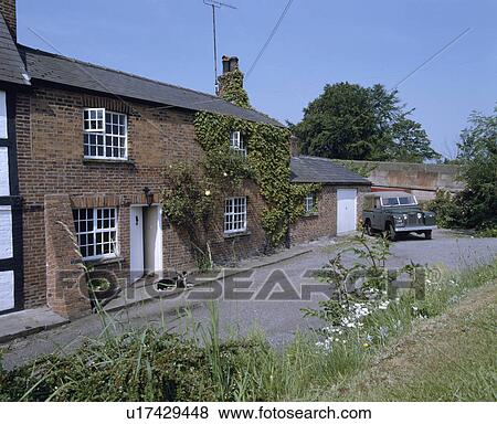 Traditional brick country cottage View Large Photo Image Stock Photo - Traditional brick country cottage. Fotosearch