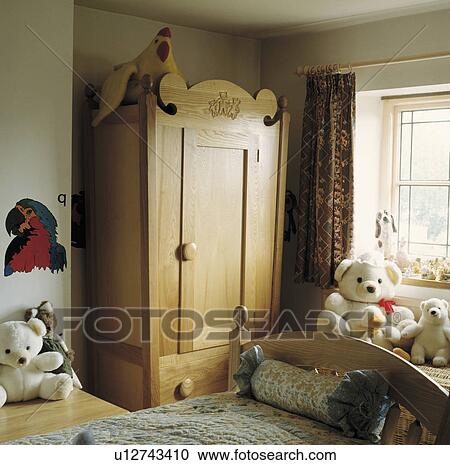 Traditional child's bedroom with large wooden wardrobe View Large Photo Image Stock Image - Traditional child's bedroom with large wooden wardrobe. Fotosearch