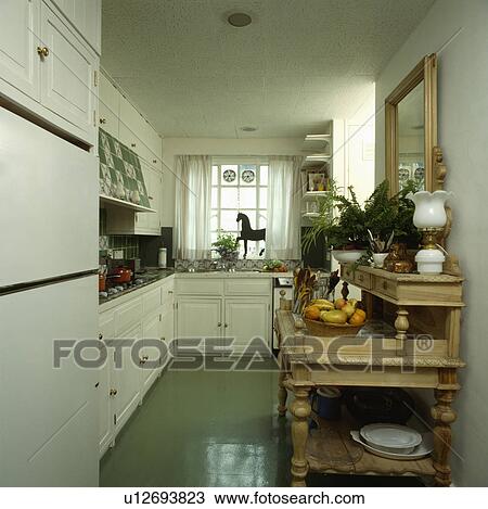 Stock Image - traditional, interior, floor, furniture, dresser, town, house. Fotosearch