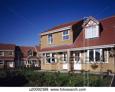 Stock Photo - Traditional newbuild house on small housing estate. Fotosearch