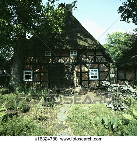 Stock Photo - Traditional thatched country cottage. Fotosearch