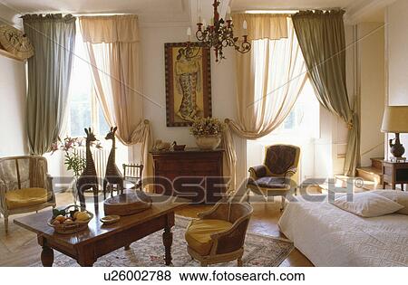 Traditional town living room with voile curtains View Large Photo Image Stock Photo - Traditional town living room with voile curtains. Fotosearch