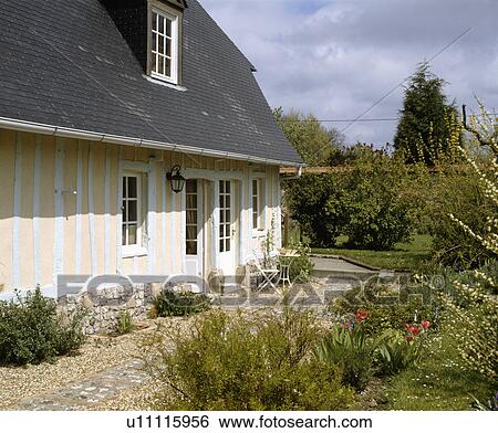 Traditional white and cream timbered country cottage in France View Large Photo Image Stock Photograph - Traditional white and cream timbered country cottage in France. Fotosearch