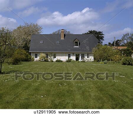 Traditional white and cream timbered country cottage in France View Large Photo Image Stock Photography - Traditional white and cream timbered country cottage in France. Fotosearch