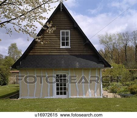 Traditional white and cream timbered country cottage in France View Large Photo Image Stock Photography - Traditional white and cream timbered country cottage in France. Fotosearch