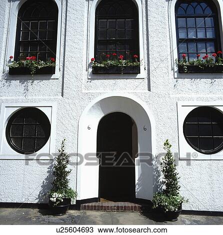 Stock Image - Traditional white town house. Fotosearch