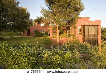 Trees and lawn around newbuild terracotta villa in Southern Spain View Large Photo Image Picture - Trees and lawn around newbuild terracotta villa in Southern Spain. Fotosearch