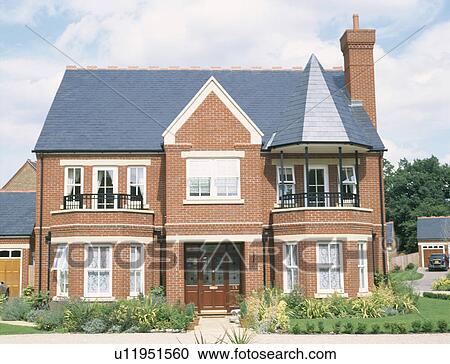 Turret roof above balcony of detached newbuild traditional brick house View Large Photo Image Stock Image - Turret roof above balcony of detached newbuild traditional brick house. Fotosearch