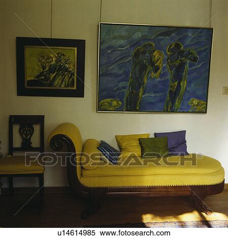 Upholstered yellow chaiselongue in traditional living room View Large Photo Image Stock Photography - Upholstered yellow chaiselongue in traditional living room. Fotosearch