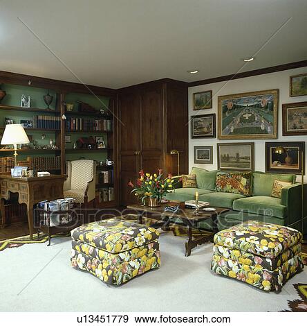 Upholstered yellow floral stools and green sofa in traditional living room View Large Photo Image Stock Photo - Upholstered yellow floral stools and green sofa in traditional living room. Fotosearch