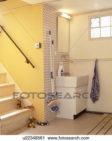 Utility room with mops stored on wall View Large Photo Image Stock Image - Utility room with mops stored on wall. Fotosearch