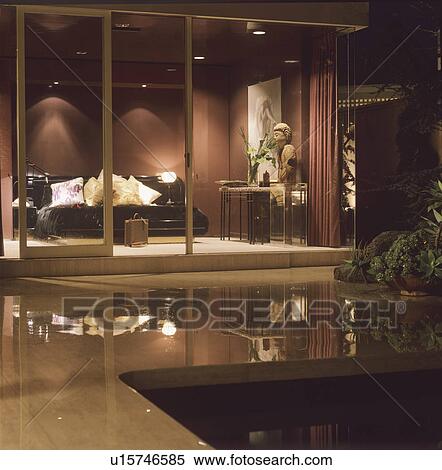 View from patio of modern living rom with glass doors View Large Photo Image Stock Photography - View from patio of modern living rom with glass doors. Fotosearch