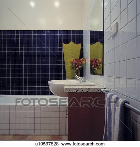 Stock Photo - White and blue tiled modern bathroom.. Fotosearch