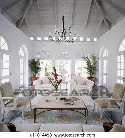 White armchairs in white living room in the West Indies View Large Photo Image Stock Photo - White armchairs in white living room in the West Indies. Fotosearch