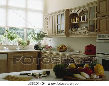 White blind in pale wood traditional kitchen View Large Photo Image Picture - White blind in pale wood traditional kitchen. Fotosearch