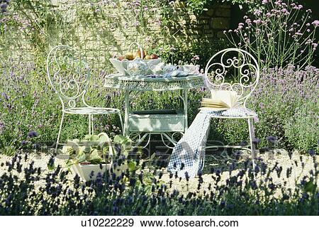 White chairs and table in country garden in summer View Large Photo Image Stock Photo - White chairs and table in country garden in summer. Fotosearch