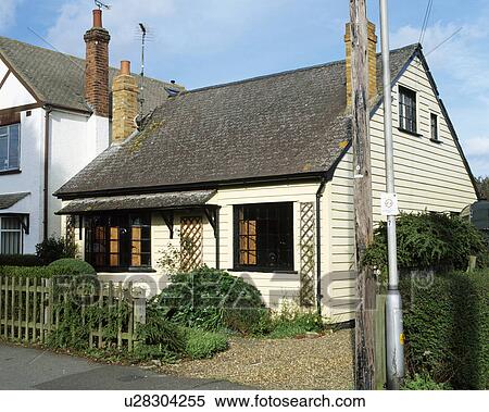 White clapboard exterior of detached suburban house with drive and fence in front. View Large Photo Image Stock Photography - White clapboard exterior of detached suburban house with drive and fence in front.. Fotosearch