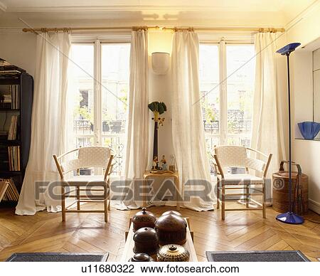White curtains and parquet floor in white apartment living room View Large Photo Image Stock Image - White curtains and parquet floor in white apartment living room. Fotosearch