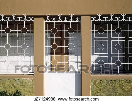 White metal security grilles on door and windows of Turkish house View Large Photo Image Stock Photo - White metal security grilles on door and windows of Turkish house. Fotosearch
