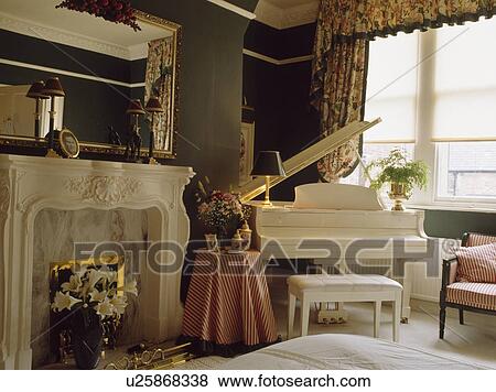 White piano in traditional living room View Large Photo Image Stock Photo - White piano in traditional living room. Fotosearch