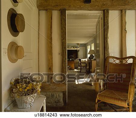 Wicker chair beside door to living room View Large Photo Image Stock Image - Wicker chair beside door to living room. Fotosearch