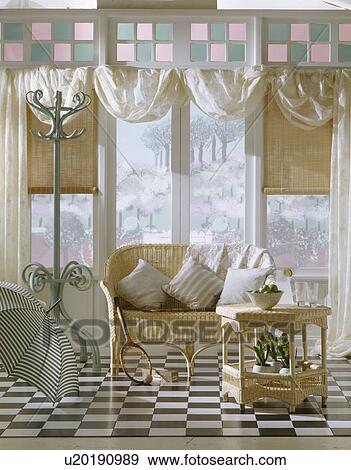 Wicker sofa and table in conservatory with black and white checquered floor View Large Photo Image Stock Photo - Wicker sofa and table in conservatory with black and white checquered floor. Fotosearch