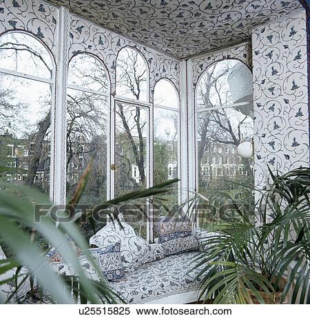 Window seat and blue+white floral wallpaper View Large Photo Image Stock Photography - Window seat and blue+white floral wallpaper. Fotosearch
