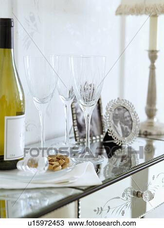 Wineglasses and wine on Venetian glass sideboard View Large Photo Image Stock Image - Wineglasses and wine on Venetian glass sideboard. Fotosearch