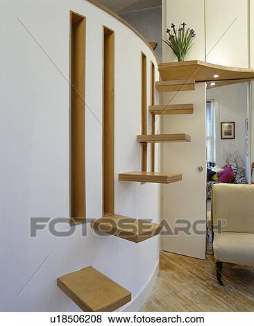 Wood stair-treads on curved wall View Large Photo Image Stock Photo - Wood stair-treads on curved wall. Fotosearch