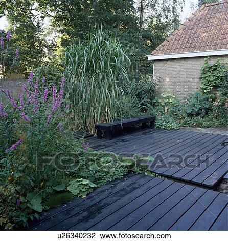 Wooden decking in country garden in summer View Large Photo Image Stock Image - Wooden decking in country garden in summer. Fotosearch