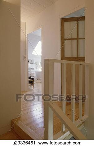Wooden flooring on small white landing with wooden bannisters View Large Photo Image Stock Image - Wooden flooring on small white landing with wooden bannisters. Fotosearch