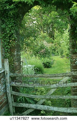 Wooden gate in country garden View Large Photo Image Stock Photo - Wooden gate in country garden. Fotosearch