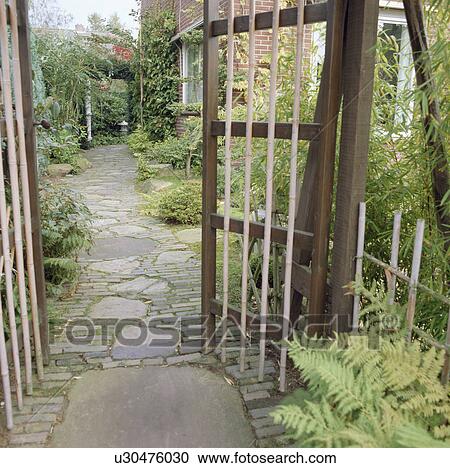 Wooden gates and path to house View Large Photo Image Stock Image - Wooden gates and path to house. Fotosearch