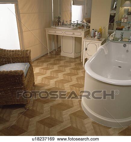 Wooden parquet floor and white freestanding bath in modern bathroom View Large Photo Image Stock Photo - Wooden parquet floor and white freestanding bath in modern bathroom. Fotosearch
