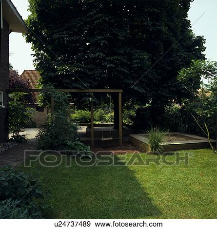 Wooden pergola in country garden in summer View Large Photo Image Stock Photo - Wooden pergola in country garden in summer. Fotosearch