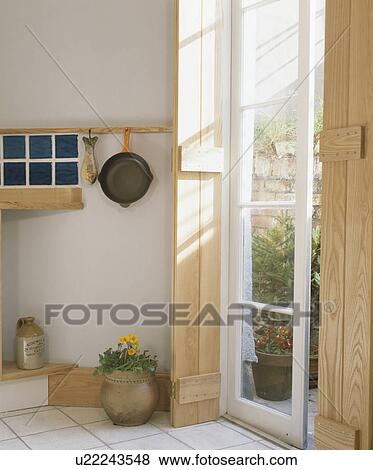 Wooden shutters at French window View Large Photo Image Stock Photo - Wooden shutters at French window. Fotosearch