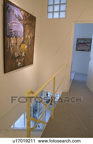 Abstract picture on wall of modern landing with yellow metal bannisters and grey carpet View Large Photo Image Stock Image - Abstract picture on wall of modern landing with yellow metal bannisters and grey carpet. Fotosearch