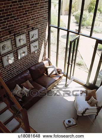 Aerial view of barn conversion living room with leather sofa View Large Photo Image Stock Photo - Aerial view of barn conversion living room with leather sofa. Fotosearch