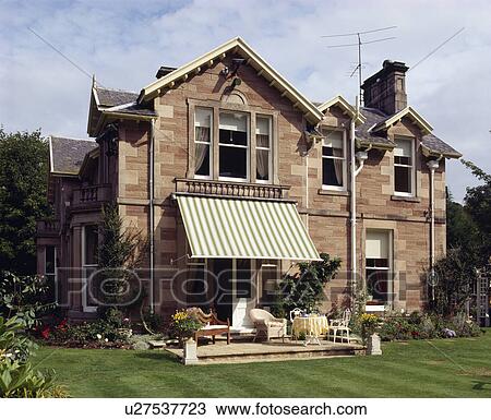 Awning above terrace of traditional Victorian house in the country View Large Photo Image Stock Image - Awning above terrace of traditional Victorian house in the country. Fotosearch