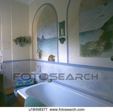 Stock Photo - Bathroom with painted trompe l'oiel mural above bath . Fotosearch