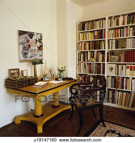 Biedermeier Desk And Antique Chair In Study With Wall Of