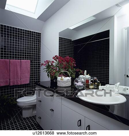 Black and white bathroom with pink towels and flowering plant. View Large Photo Image Stock Photo - Black and white bathroom with pink towels and flowering plant.. Fotosearch